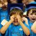A Safety Town graduate imitates a crying baby as he sings "The Wheels on the Bus," during graduation at Dicken Elementary School on Friday, July, 26, 2013. Melanie Maxwell | AnnArbor.com
